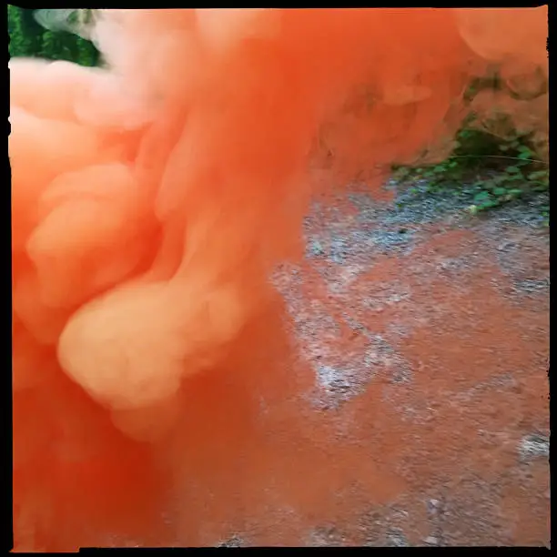 Smoke from orange smoke bomb.  iPhone