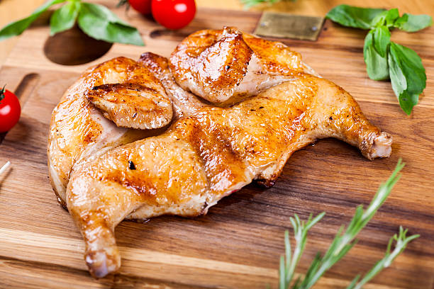 istock Grilled chicken on wooden board 542815108