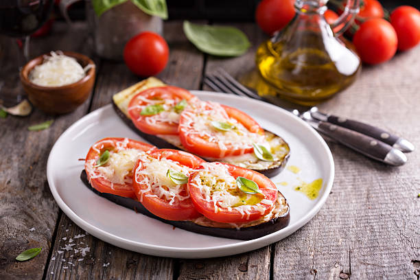 istock Grilled zucchini with tomatoes and cheese 542816276
