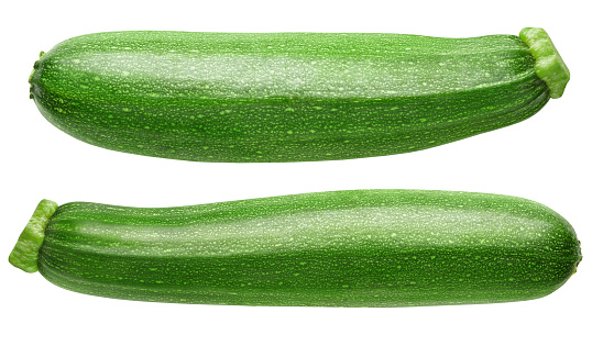 Isolated zucchini. Two zucchini or courgettes isolated on white background with clipping path