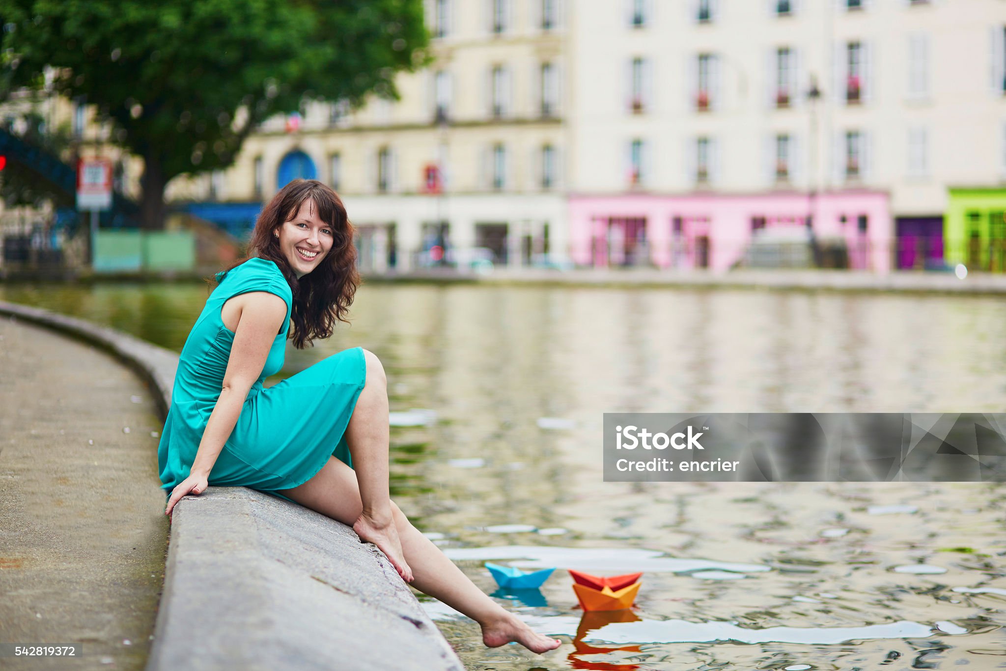 https://media.istockphoto.com/id/542819372/photo/woman-playing-with-paper-boats-on-canal-saint-martin.jpg?s=2048x2048&amp;w=is&amp;k=20&amp;c=zi7tab3o84Ac0W4BB1x4ArEj7JYPgBus857m9jPTblw=