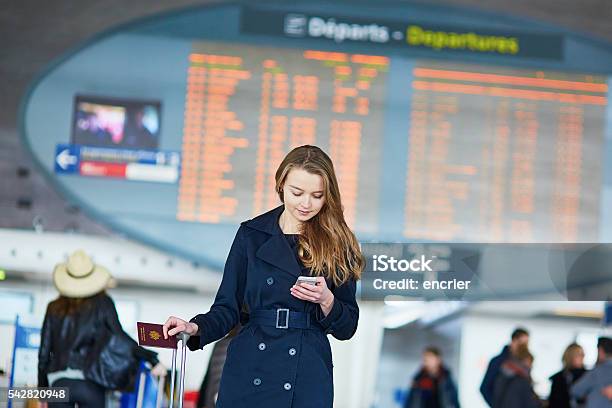 Young Female Traveler In International Airport Stock Photo - Download Image Now - Adult, Airport, Arrival