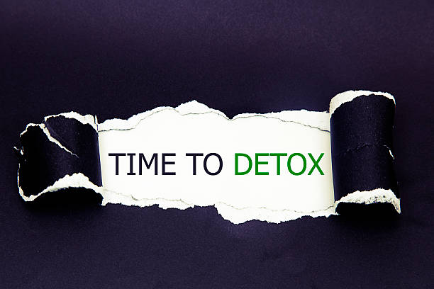 istock time to detox written under torn paper 542821514