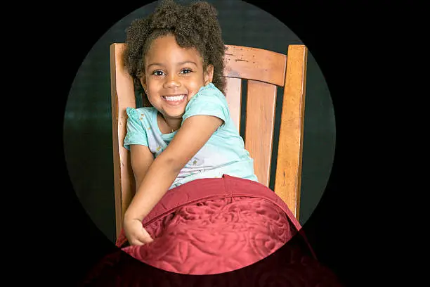 African American young girl/child with natural hair pose sitting 