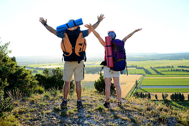 istock young couple backpacker on mountain trek admiring beautiful sunset landscape 542822988