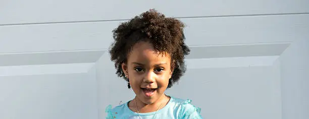 African American young girl/child with natural hair excited facial expression.