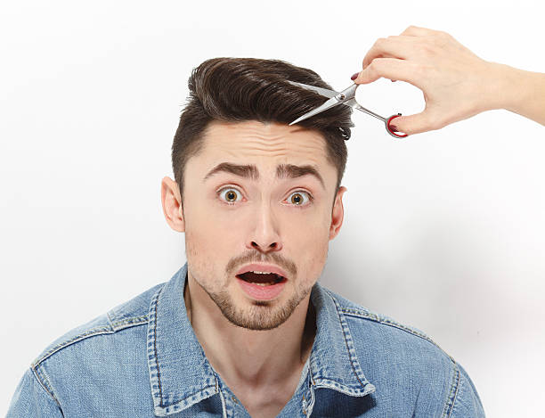 istock Handsome man having haircut 542824346