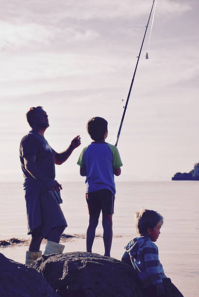 istock Father and Sons Fishing 542824750