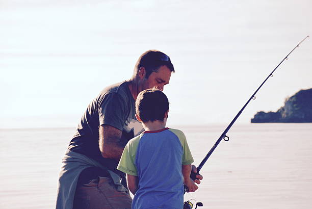 istock Father and Son Fishing 542824854