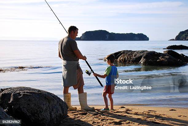 Father And Son Sea Fishing Stock Photo - Download Image Now - New Zealand, Fishing, Nelson City - New Zealand