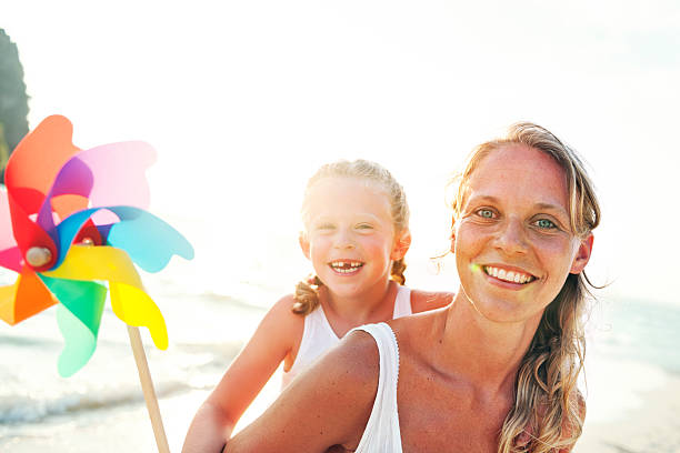 istock Mother Daughter Fun Happiness Beach Bonding Concept 542825572