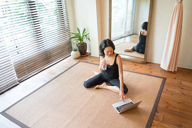 istock Asian woman working out at home 542827934