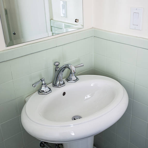 istock Retro style white porcelain bathroom sink 542829410