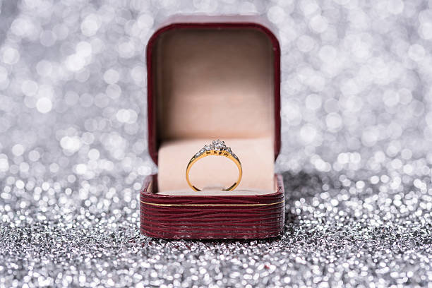 istock gold ring with diamond. Jewelry with bokeh background 542830472