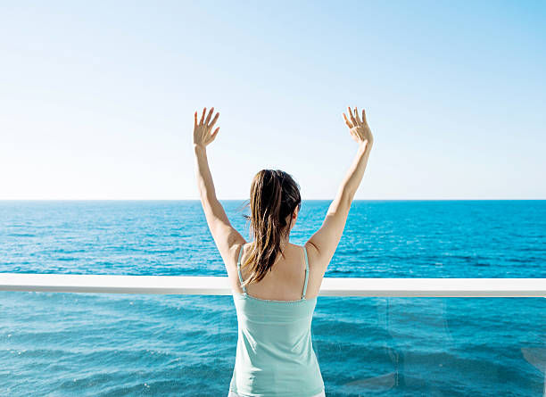 istock Woman open arms on cruise 542830790