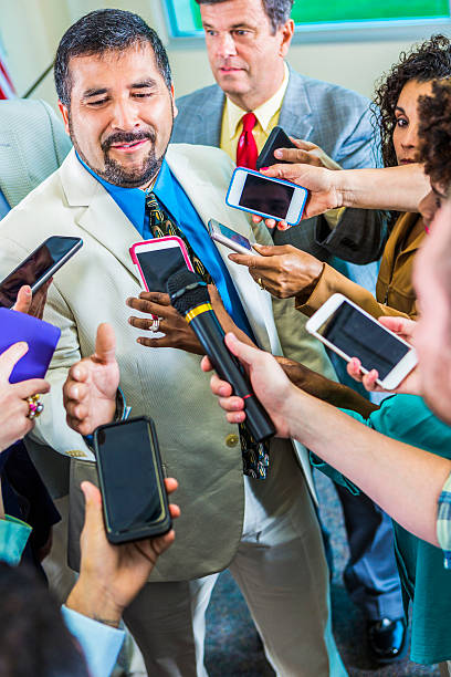 istock Frustrated man speaks to journalists 542831452