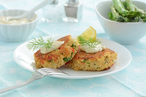 Crab Cakes Fresh home made crab cakes with creamy lemon dill sauce crab seafood photos stock pictures, royalty-free photos & images