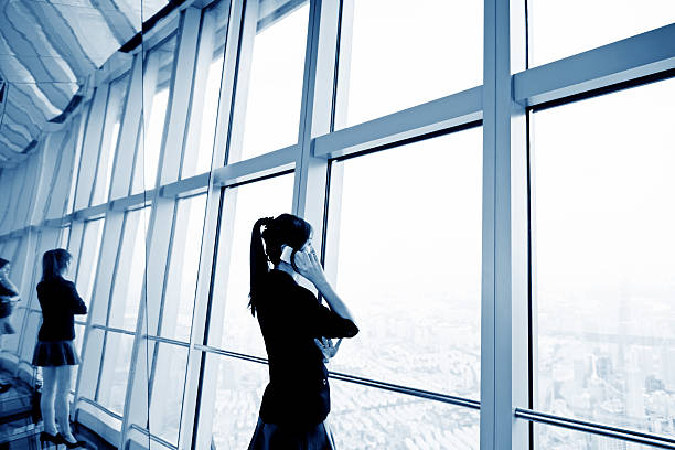 istock Businesswoman on mobile phone 542832108