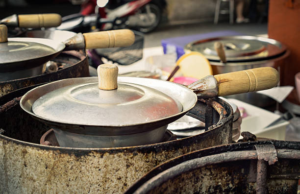 Old pots cooking on stove in the kitchen, Close up and selective focus