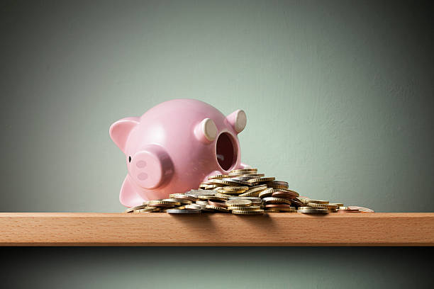 istock Savings. Piggy bank with coins 542834920