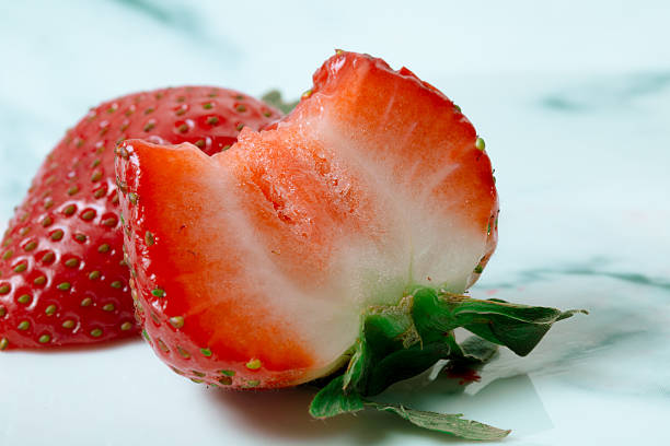 istock Ripe red strawberries on white plate 542837022