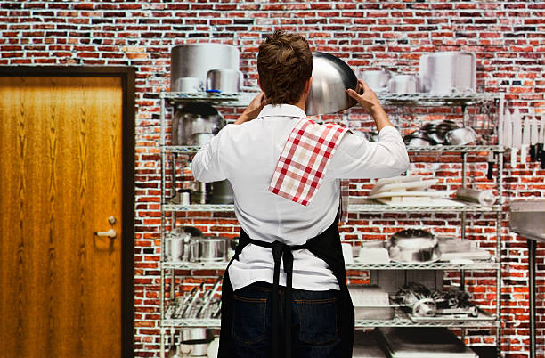 istock Rear view of chef standing in kitchen 542838810