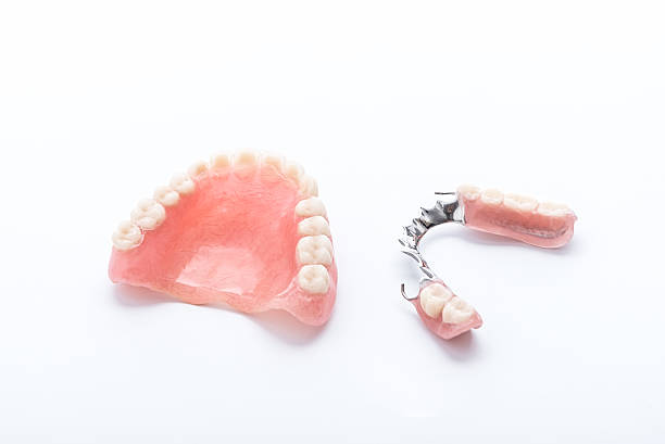 istock Set of dentures on white background 542927068