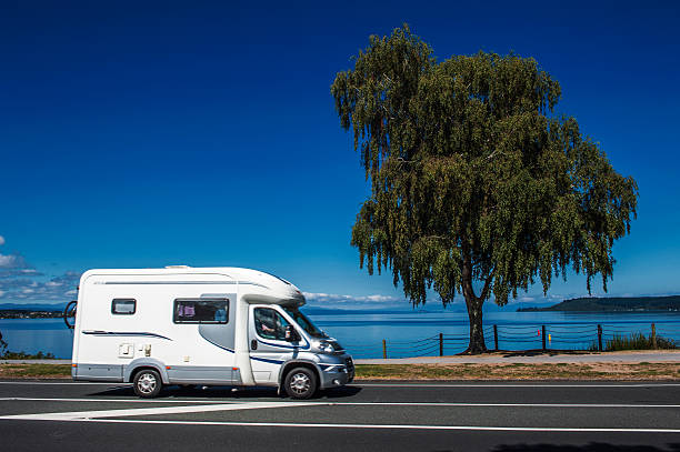 Campervan driving along Lake Taupo, New Zealand Taupo, New Zealand - March 2, 2015: Campervan driving along Lake Taupo, New Zealand tongariro national park photos stock pictures, royalty-free photos & images