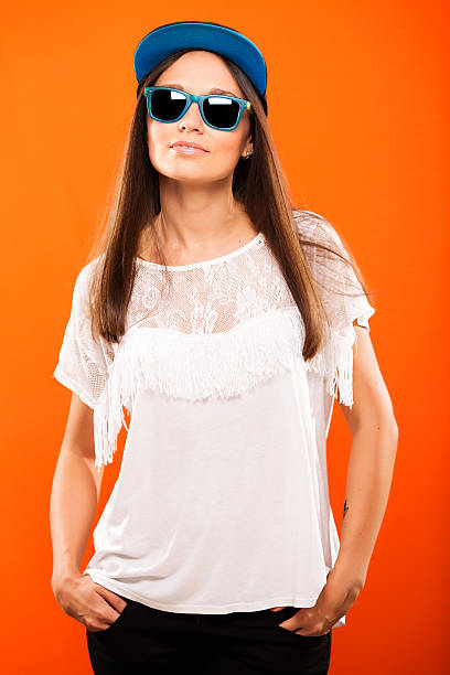 istock Attractive girl posing on orange background 542928964
