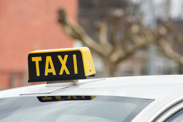 istock Taxi sign on white car. 542930538