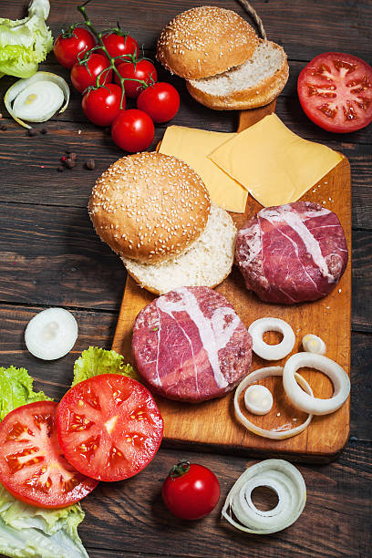 istock Ingredients for making homemade burger on wooden cutting board 542932010