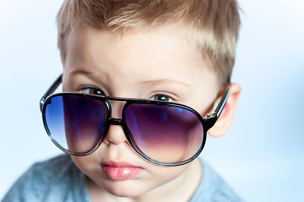istock Charming three years old boy in sunglasses 542932396