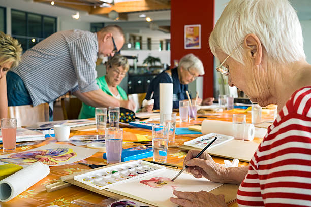 istock Students working hard on watercolor paintings. 542933668