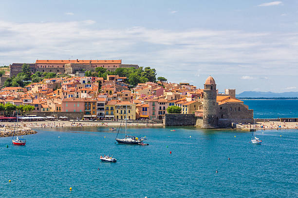 Collioure Collioure, France - June 25, 2016: Tourists enjoy the beach of Collioure, coastal village in the south of France, Mediterranean sea, Languedoc Roussillon, Pyrenees Orientales collioure stock pictures, royalty-free photos & images