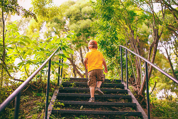 Little girl walking on the staircase