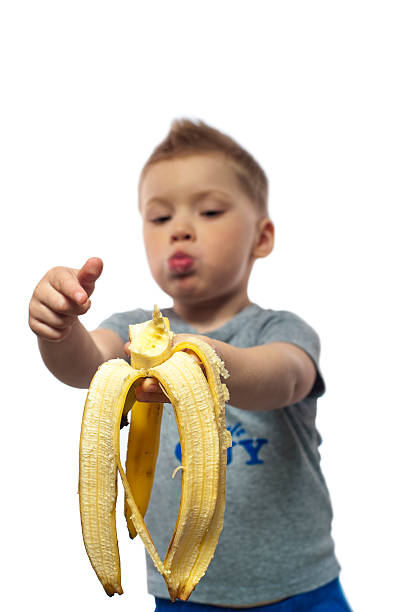 istock Cute kid with banana 542942068