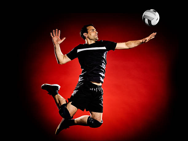 volley ball player man isolated one caucasian volley ball player man isolated on colorful black background male volleyball player stock pictures, royalty-free photos & images