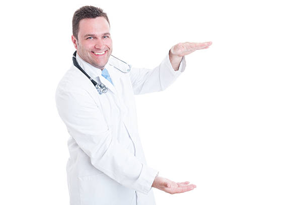 istock Male medic smiling and holding copyspace with two hands 542944570