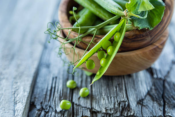 istock Green pias on rustic wood background 542945524