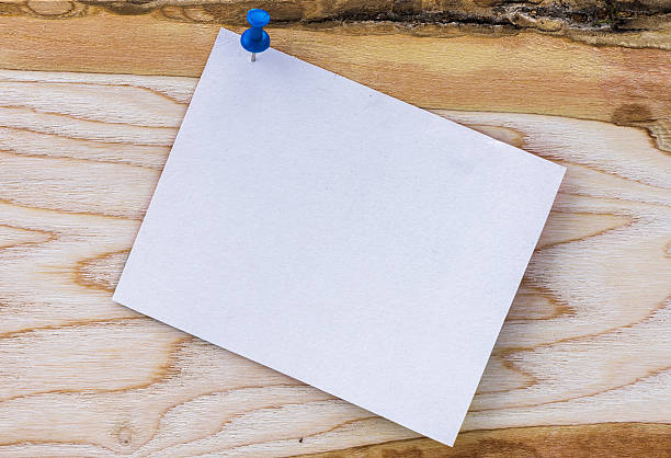istock white paper on the wood background 542946076