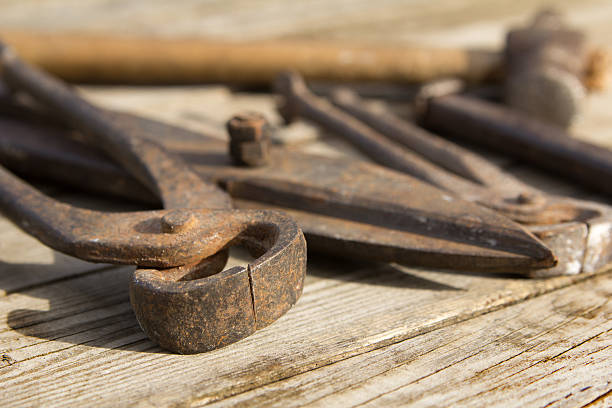 istock Rusty set of hand tools on a wooden background. Vintage 542946894