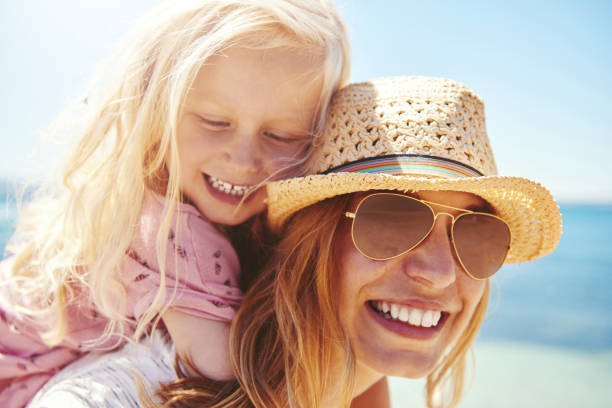 istock Young mother with her daughter at the beach 542946976