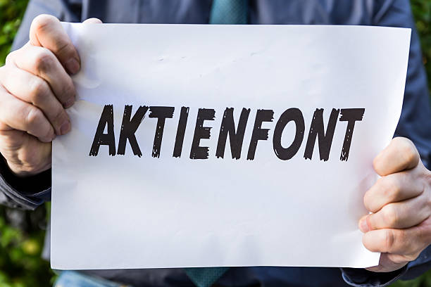istock Businessman is holding a paper with german word 542950836
