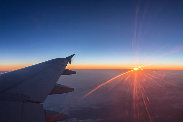 istock Sunrise over a commercial airline wing in high altitude flight 542951164