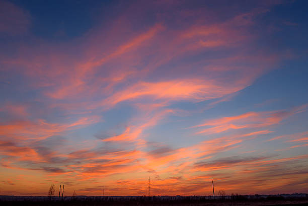 istock sunset sky clouds orange electric power lines tower 542951650