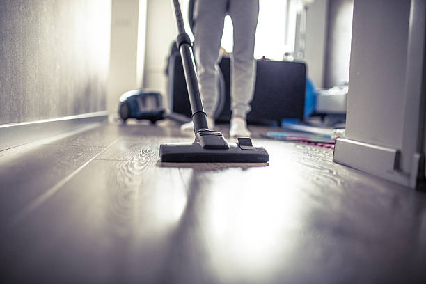 istock Girl vacuuming the floor 542952080