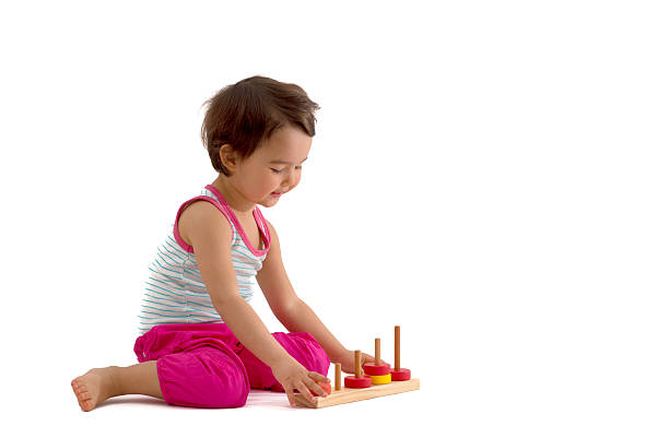 istock Child playing with educational cup toys. Isolated on white background 542953472