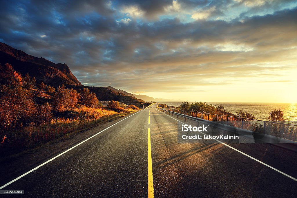 road by the sea in sunrise time,  Lofoten island, Norway Sea Stock Photo