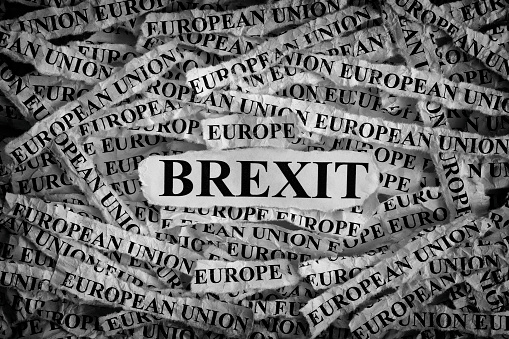 Brexit. Torn pieces of paper with the word Brexit. Concept Image. Black and White. Closeup.