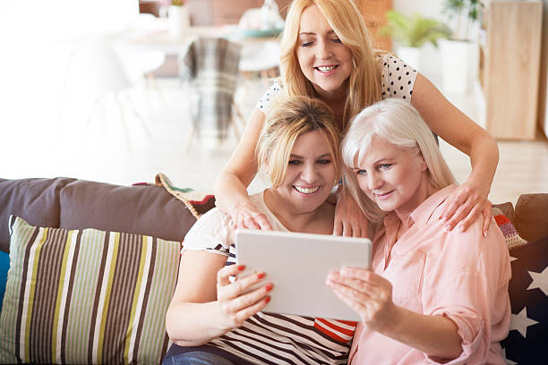 istock Modern mature women with digital tablet 542957070